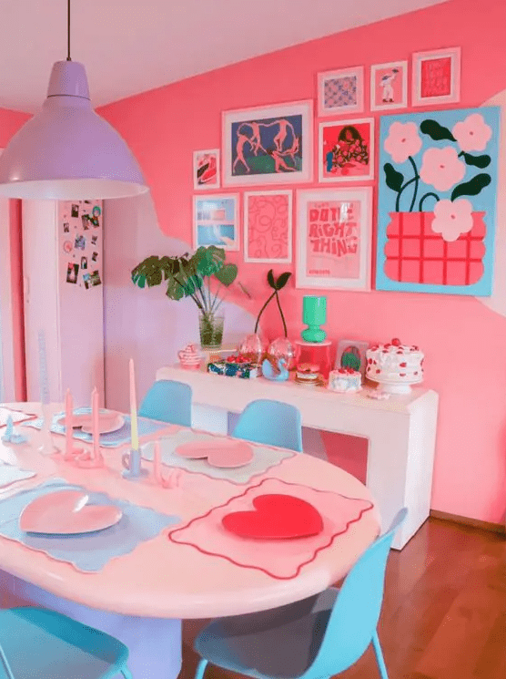 a super bold dining room with hot pink walls, white tables and blue chairs, a lilac pendant lamp, a bright gallery wall and bold decor