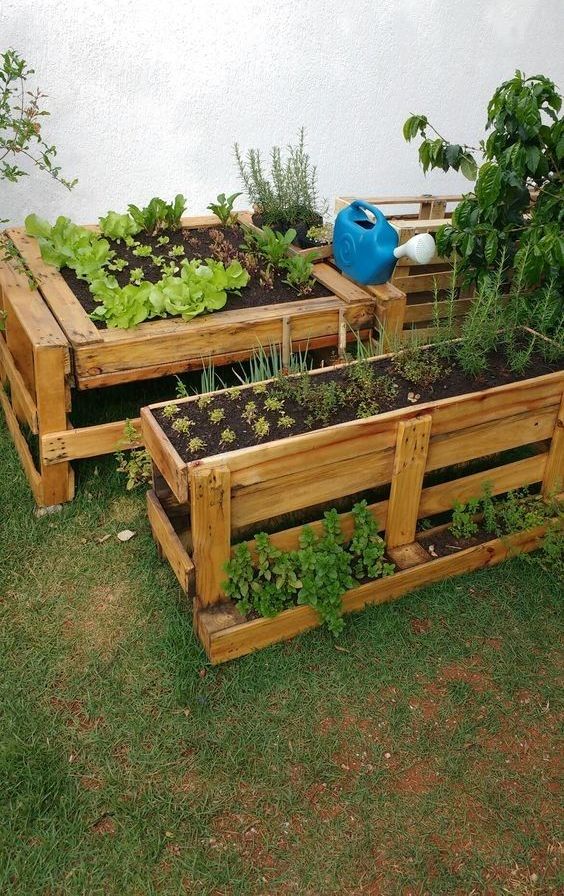 a whole stained garden built of old pallets restained is a super cool idea, it's raised, which keeps some animals away and working on it is more comfortable