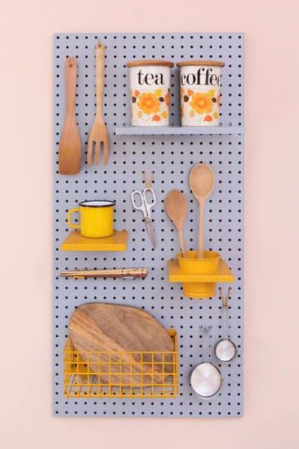 an ocean blue pegboard with shelves is a cool idea for a kitchen, it provides you with storage space and adds a touch of color