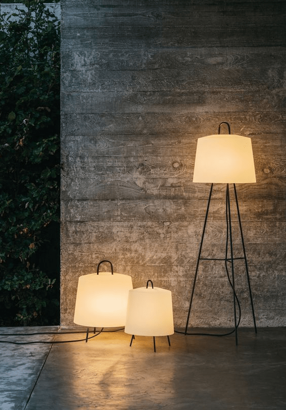 floor lamps with pretty and classic lampshades and multiple legs are great for a modern outdoor space, and handles allow moving them here and there