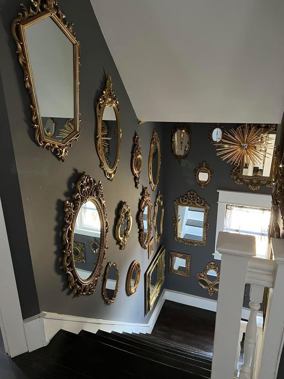 Grey walls over the stairs with gallery walls of mirrors are amazing to make your space refined, chic and eye catchy