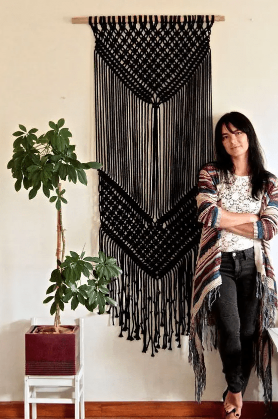 if you are good at macrame, you may create such a black hanging for statement boho decor