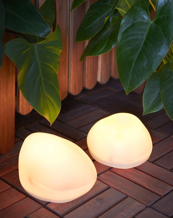 pebble-like outdoor lamps are always a good idea as they bring a lovely natural touch to the space