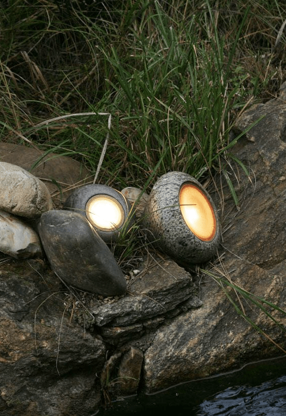 pebble-like outdoor mini lamps will make your outdoor space illuminated but close to nature at the same time