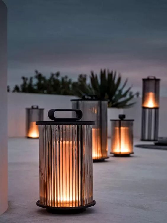 stylish ribbed smoked glass lamps with handles are great and chic portable lamps for outdoors