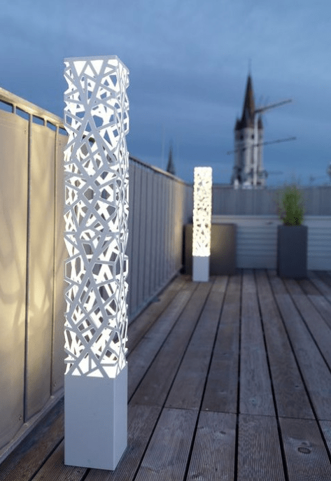 white pillar cutout outdoor lamps are a modern idea with a bit of edge, they provide your space with a lot of light taking just some floor space