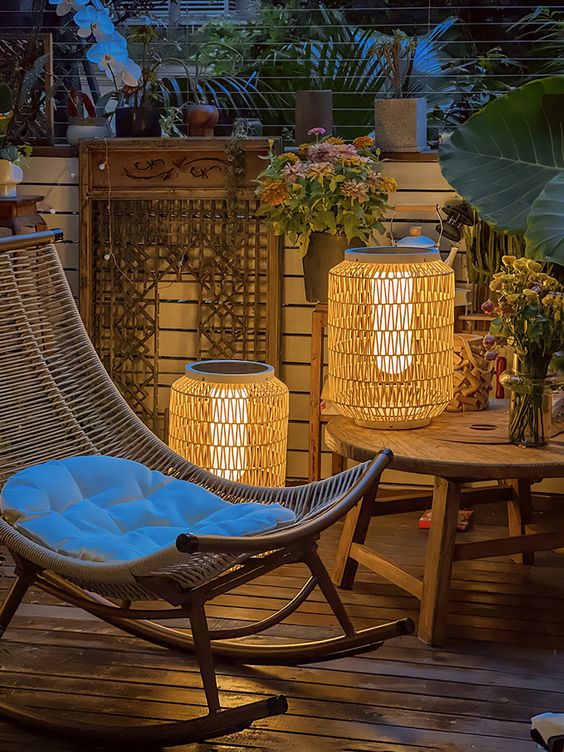 woven lanterns with light inside imitate candle lanterns and bring texture and coziness to the space