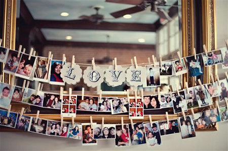 LOVE family photo display on clothspins (via bios)