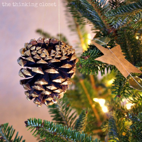 gold pinecone ornaments (via thinkingcloset)