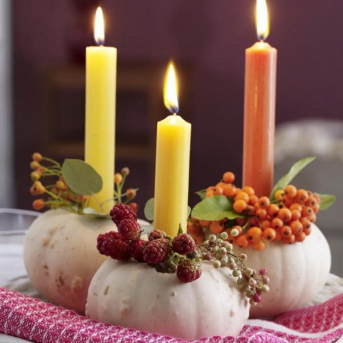 DIY pumpkin candle holders decorated with mountain-ash berries or raspberry is a really cheap way to create a beautiful fall centepiece if your budget tends to go more towards Halloween and Christmas.