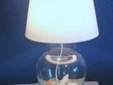 glass vase lamp filled with sand and shells