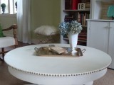 white round coffee table with nails