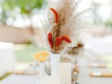 candles, dried grasses and blooms and faux pumpkins will make your fall table decor very chic and trendy