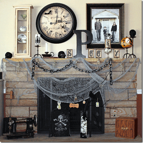 a vintage inspired Halloween mantel with grey spiderweb, chunky chains, monograms, skulls, spheres and blackbirds