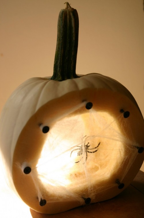 spider nest glowing pumpkin (via shelterness)