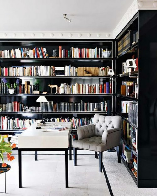 casual ceiling trim adds to the home office and contrasts the dark bookshelves