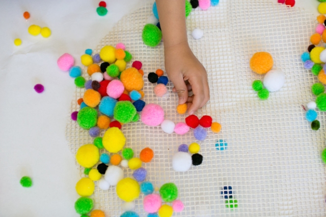 Picture Of colorful and easy diy pompom rug  3