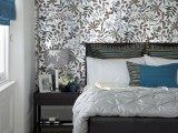 a stylish bedroom with a botanical accent wall that makes it catchier and bolder at once