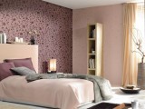 a soft pastel bedroom done in blush and pastels and with a deep purple patterned accent wall for a touch of color