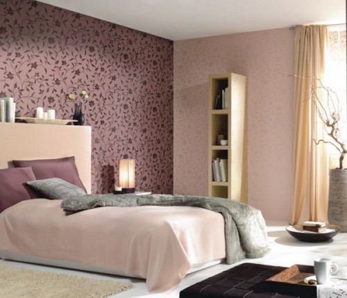 a soft pastel bedroom done in blush and pastels and with a deep purple patterned accent wall for a touch of color
