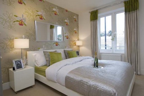 a light grey bedroom with a floral wall and matching bedding to give a lively look and a fresh feel to the room