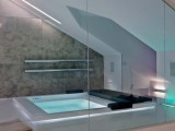 a bathroom with a skylight to fill it with natural light