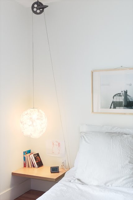 a fluffy hanging sphere lamp brings in some light and softens the interior design with its shape and look