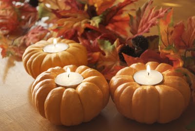 little pumpkin candle holders (via shelterness)