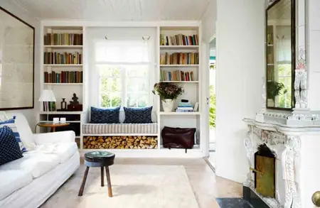 a windowsill sitting space and two bookcases built in on each side of the bench for comfortable reading
