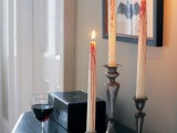 bloody candles in vintage candleholders are stylish and scary Halloween decorations you can easily DIY