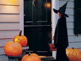 oversized carved pumpkin lanterns are bold decorations that will create a mood both indoors or outdoors