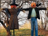 creepy Halloween scarecrows – a man and a woman dressed in usual clothes look weird and scary