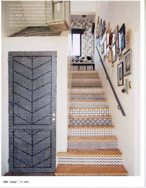 doors with creative grey patterns and matching tiles on the stairs make the space bolder and catchier