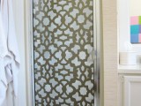 a simple shower door made bolder with pretty stencils looks outstanding and eye-catching