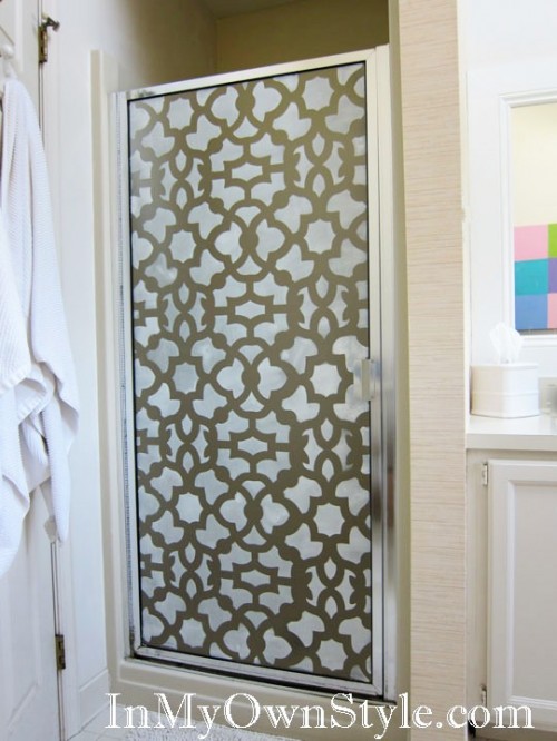 a simple shower door made bolder with pretty stencils looks outstanding and eye-catching