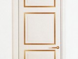a neutral door stenciled up with gold looks bold, chic and interesting and will fit many spaces