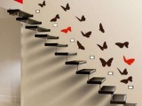 black and red butterfly decals over the airy staircase make it look very more lightweight and cool