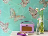 green wallpaper with colorful butterfly print is a cool idea to make a statement in your home