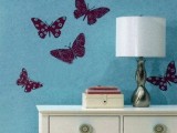 blue wallpaper with deep purple butterfly decals that can be removed in case you get tired of them