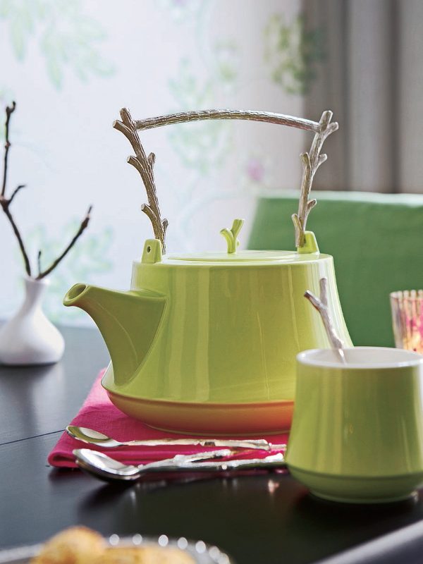 a kettle with a stick handle and some stick handle spoons is a cool idea for adding a natural touch to your table