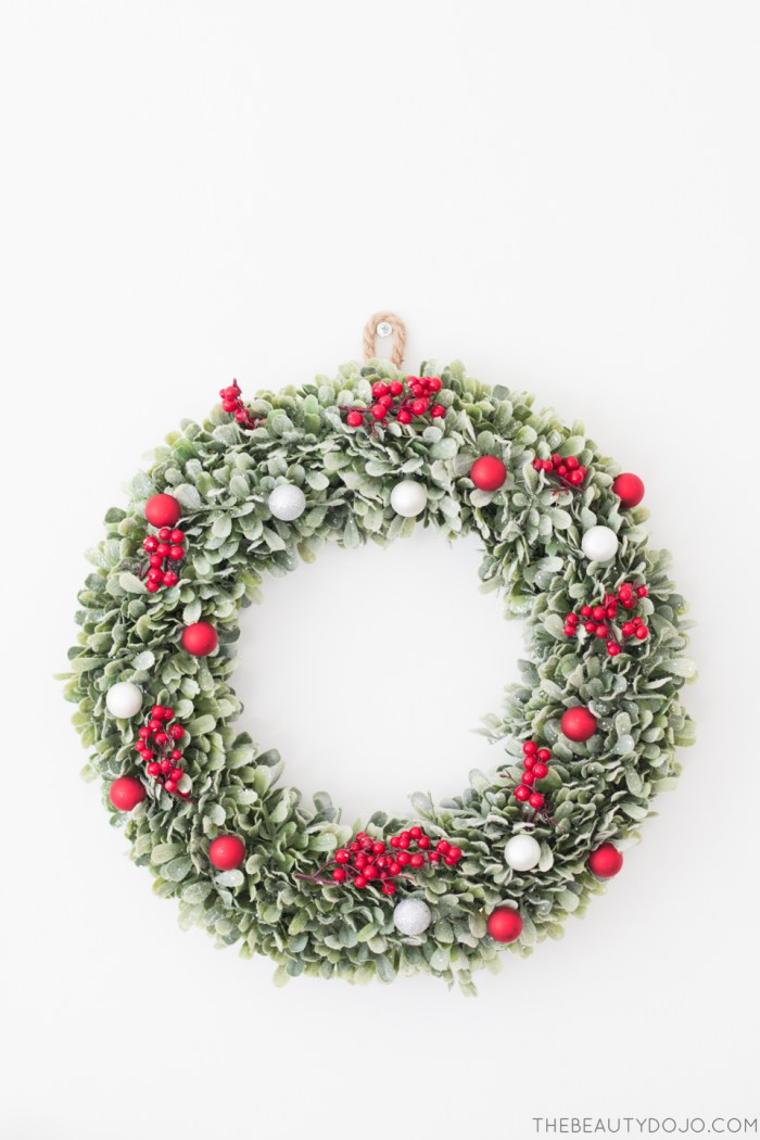 Picture Of diy christmas wreath with holly and small ornaments  5
