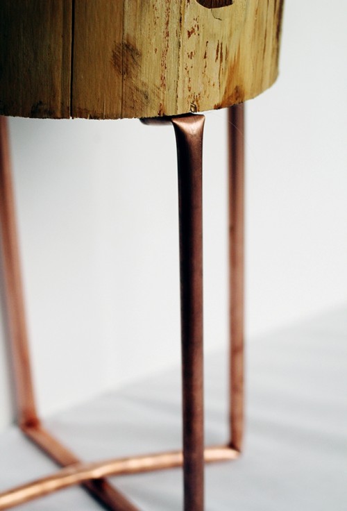 copper pipe and wood slice table (via shelterness)