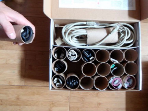 DIY cable organizers of paper rolls (via shelterness)
