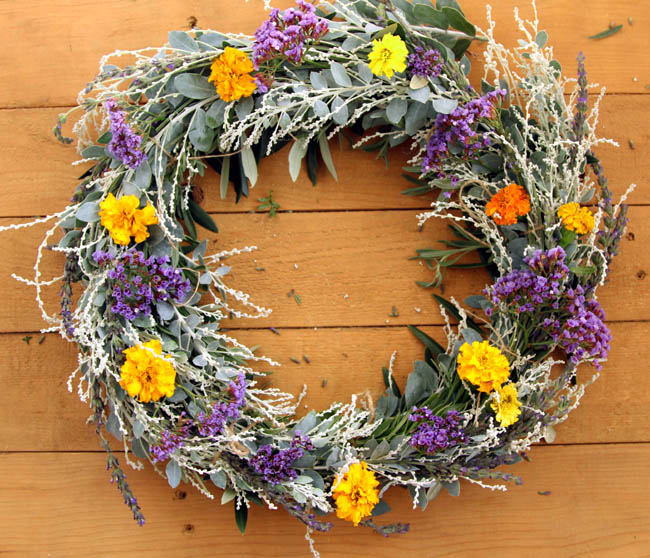 Picture Of diy dollar store wreath with natural flowers and greenery  1