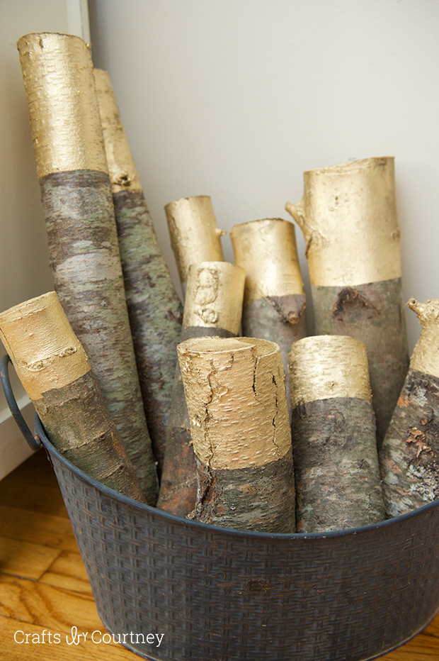 Picture Of diy gold painted logs for rustic decor  1