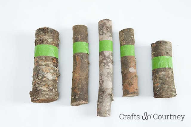 Picture Of diy gold painted logs for rustic decor  3