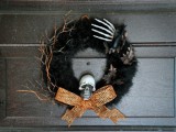 Halloween wreath with a skull and a hand