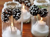 snowy pinecones candle jars