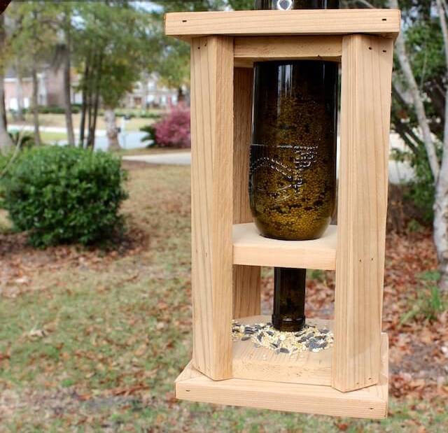 Picture Of diy wine bottle and wood bird feeder  1
