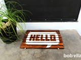 diy-wooden-doormat-with-a-cheery-greeting-10